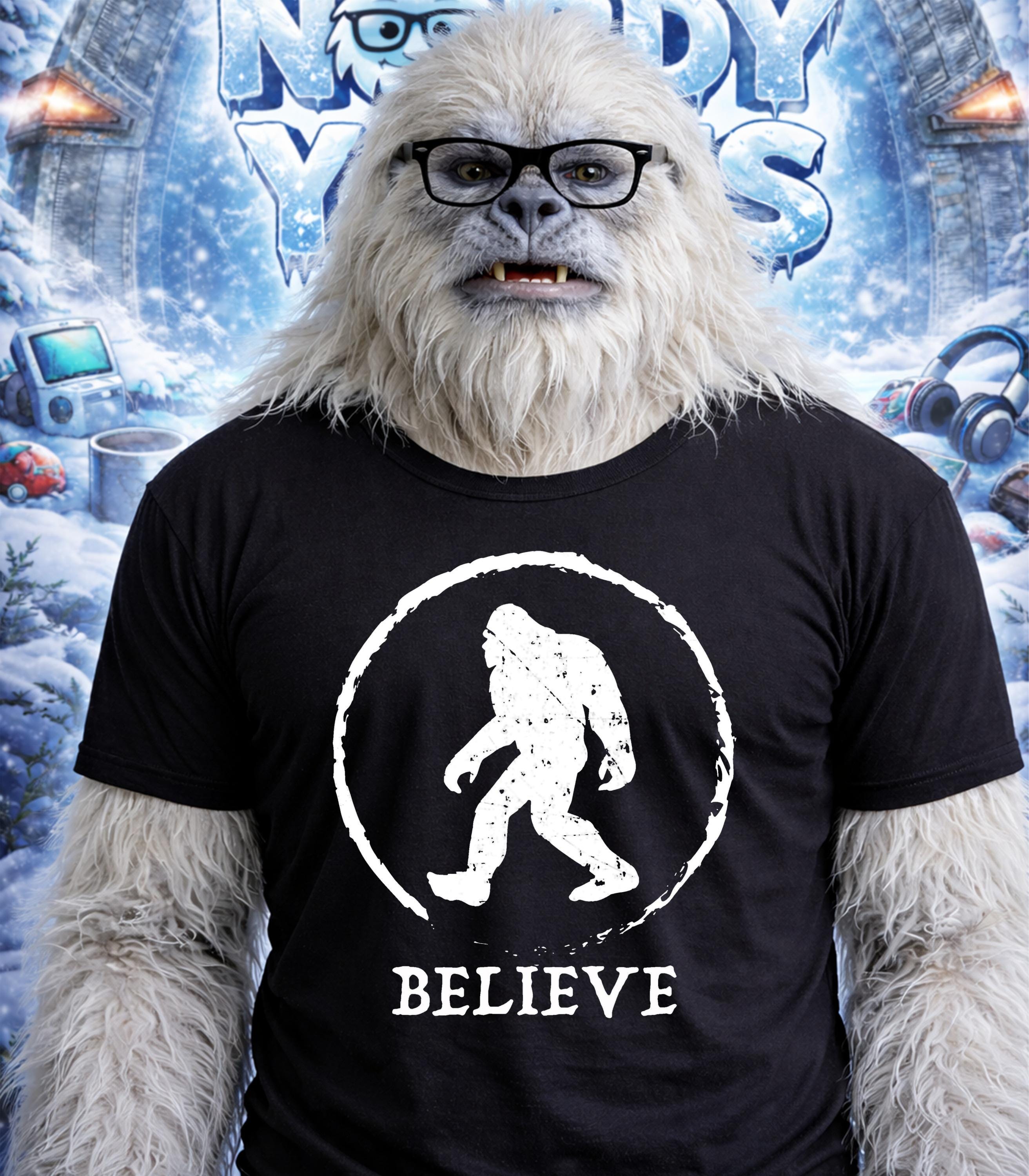 Furry white yeti wearing glasses and a black t-shirt with a "Believe" Bigfoot logo.
