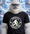 Yeti wearing glasses and a "Sasquatch Research Team" t-shirt.