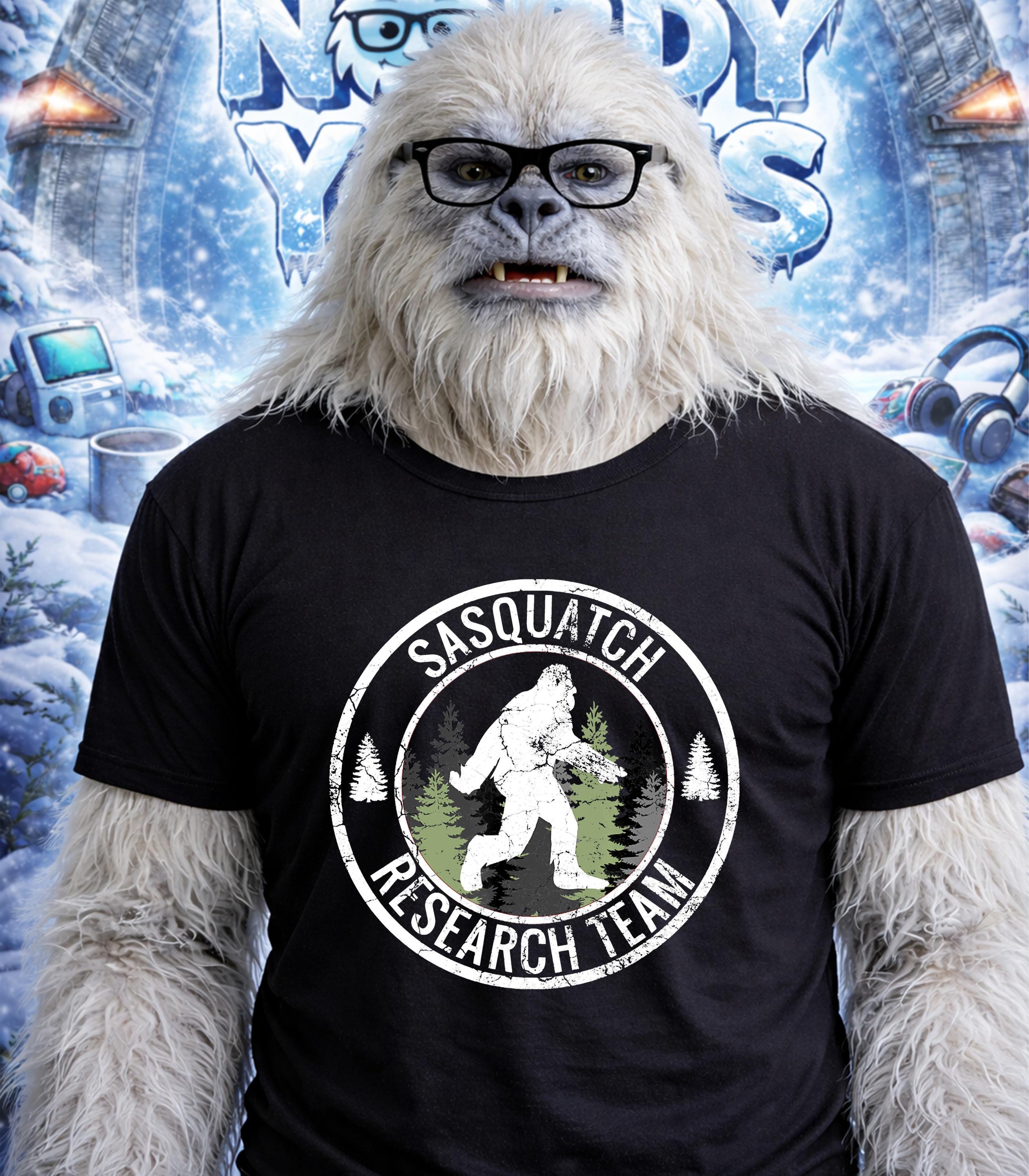 Yeti wearing glasses and a "Sasquatch Research Team" t-shirt.