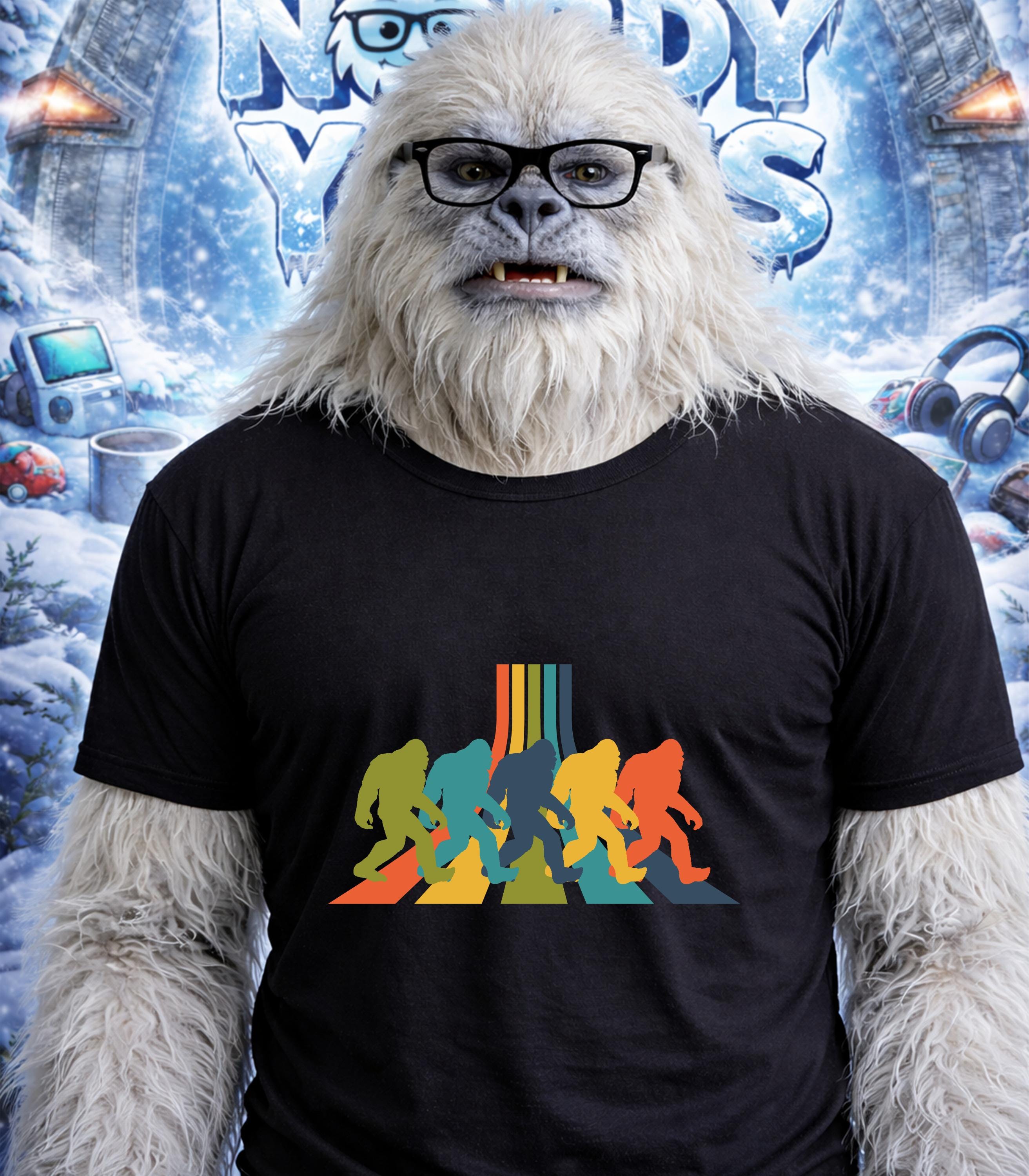 Yeti wearing a t-shirt with colorful Bigfoot silhouettes crossing a road.