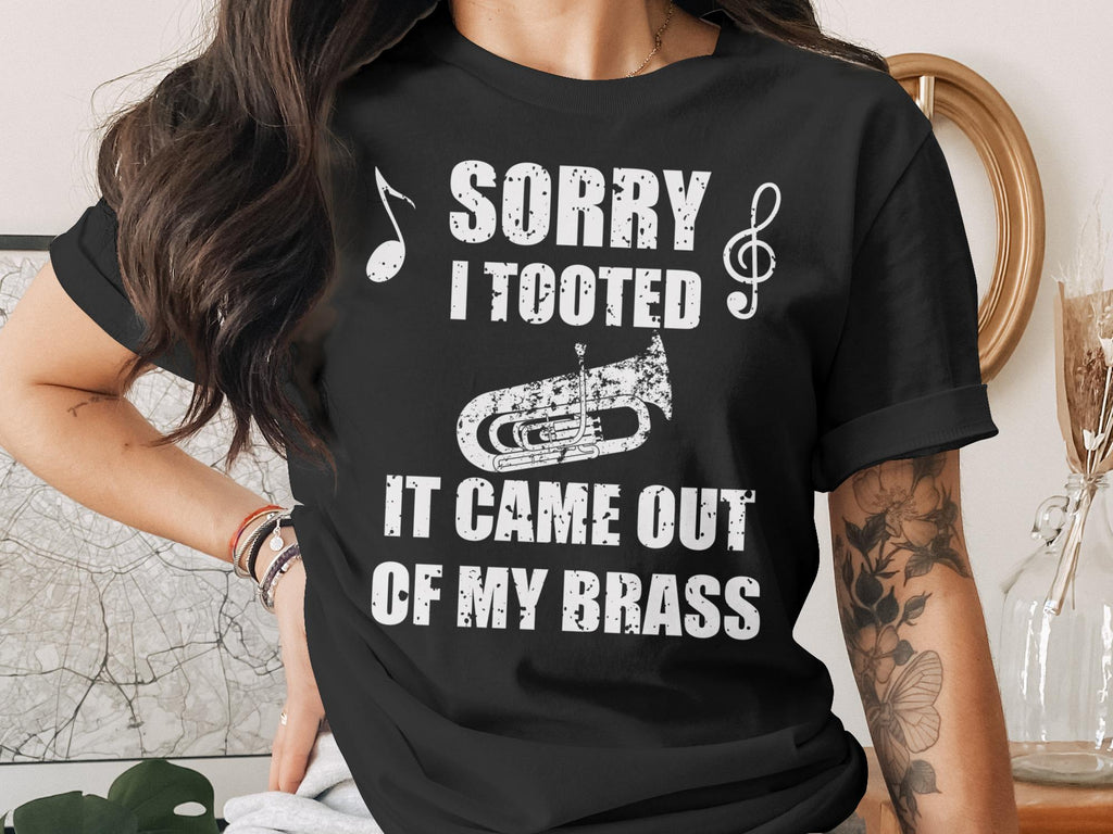 Black t-shirt with "Sorry I Tooted, It Came Out Of My Brass" and tuba graphic.