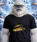 Yeti wearing glasses and a t-shirt with a gnome village in footprints.