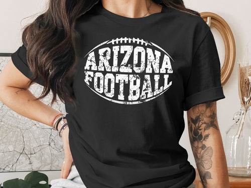 Black t-shirt with "Arizona Football" text and football graphic.