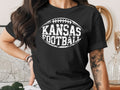 Black t-shirt with "Kansas Football" in a football graphic.