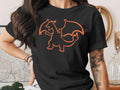 Black t-shirt with orange outline of a dragon with wings.