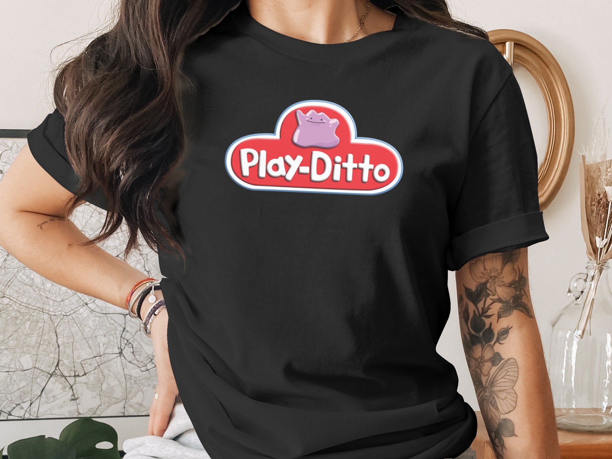 Black t-shirt with a white cloud logo and "Play-Ditto" text.