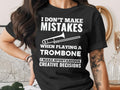 Black t-shirt with white text and trombone graphic reading "I Don't Make Mistakes When Playing a Trombone I Make Spontaneous Creative Decisions".