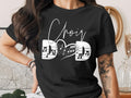 Black t-shirt with "Choir Dad" text and music notes forming a heart.
