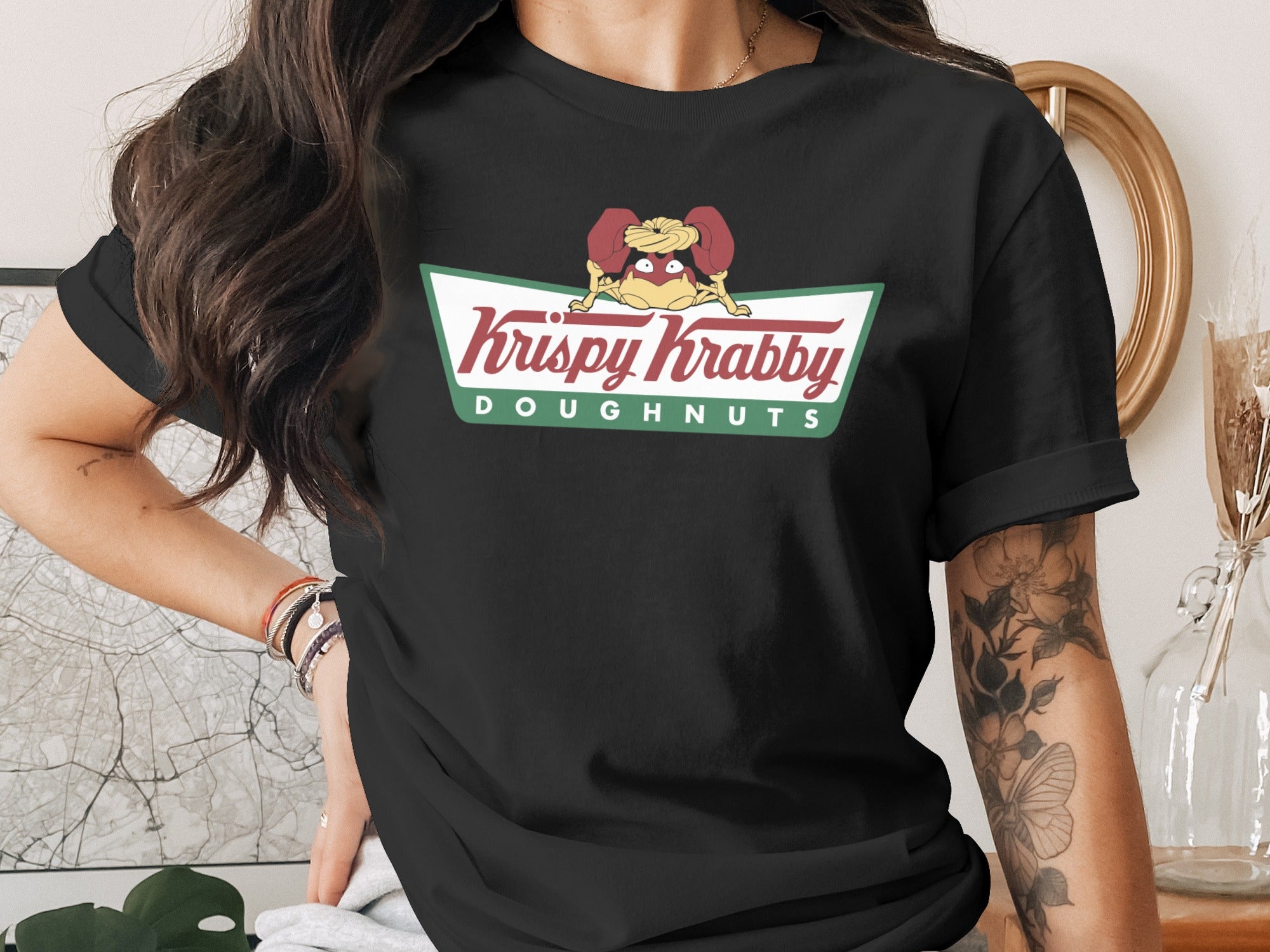 Black t-shirt with Krispy Kreme Doughnuts logo featuring a cartoon dog.