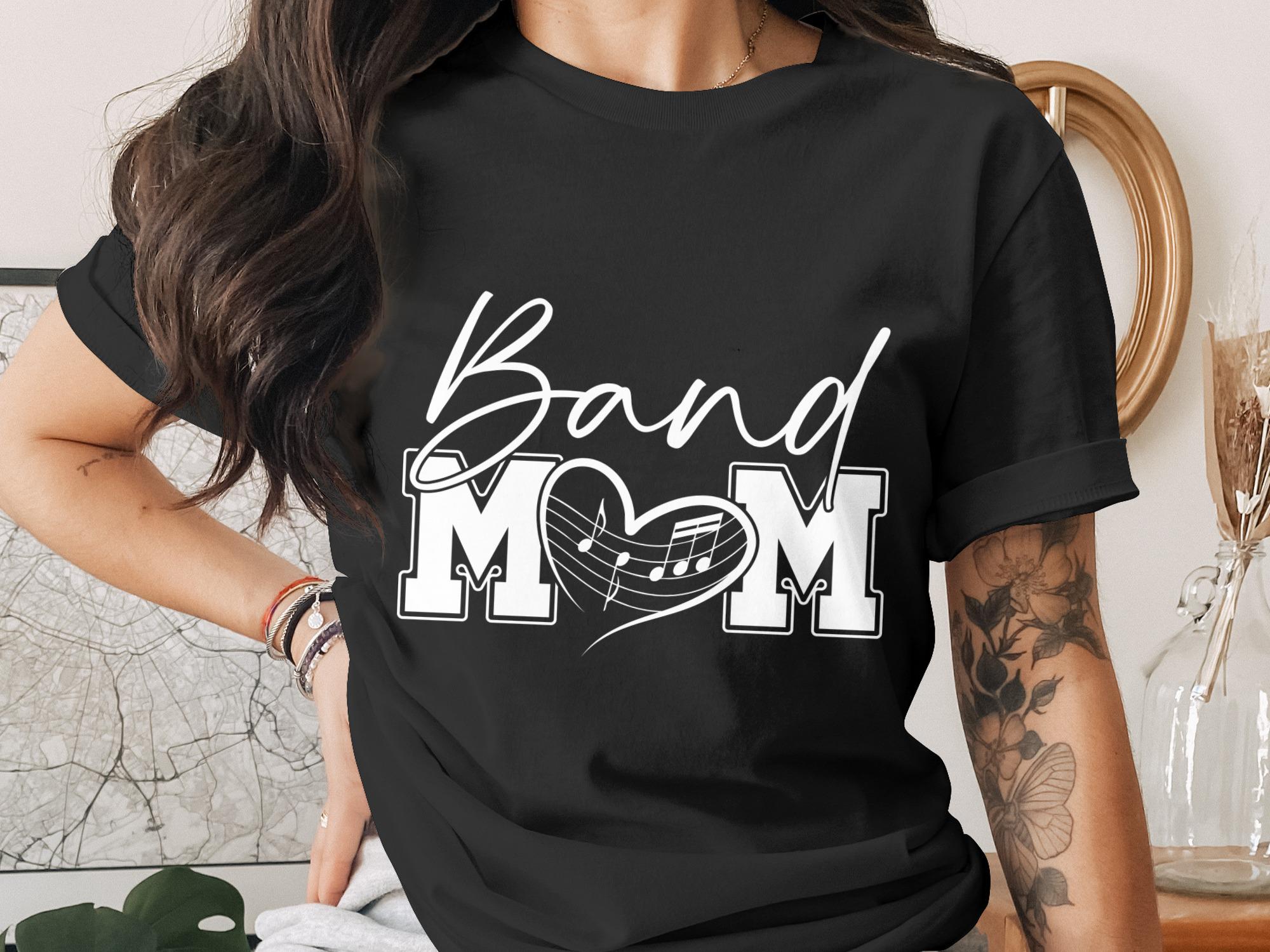 Black t-shirt with "Band Mom" in white script and heart music note design.