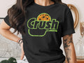 T-shirt with green "Crush" logo and orange polka dot pattern.
