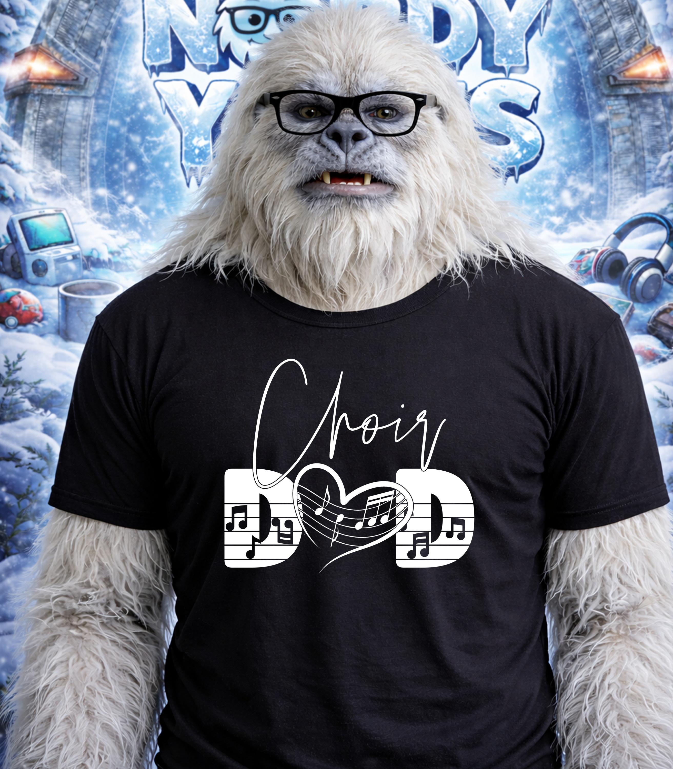 Yeti wearing glasses and a black t-shirt with "Choir Dad" and musical notes.