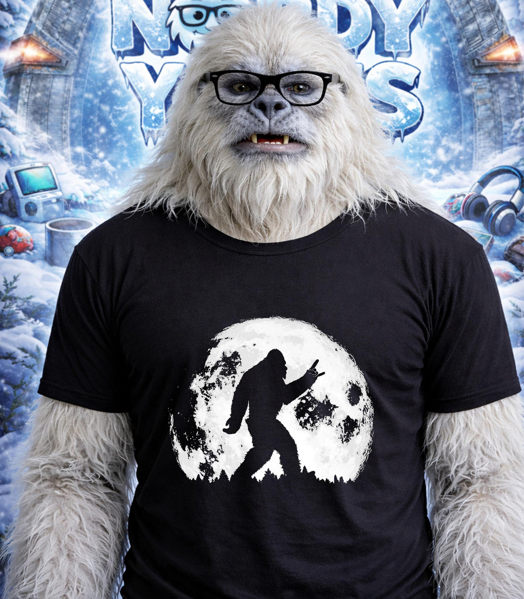 Yeti wearing glasses and a t-shirt with a Bigfoot silhouette against a moon.