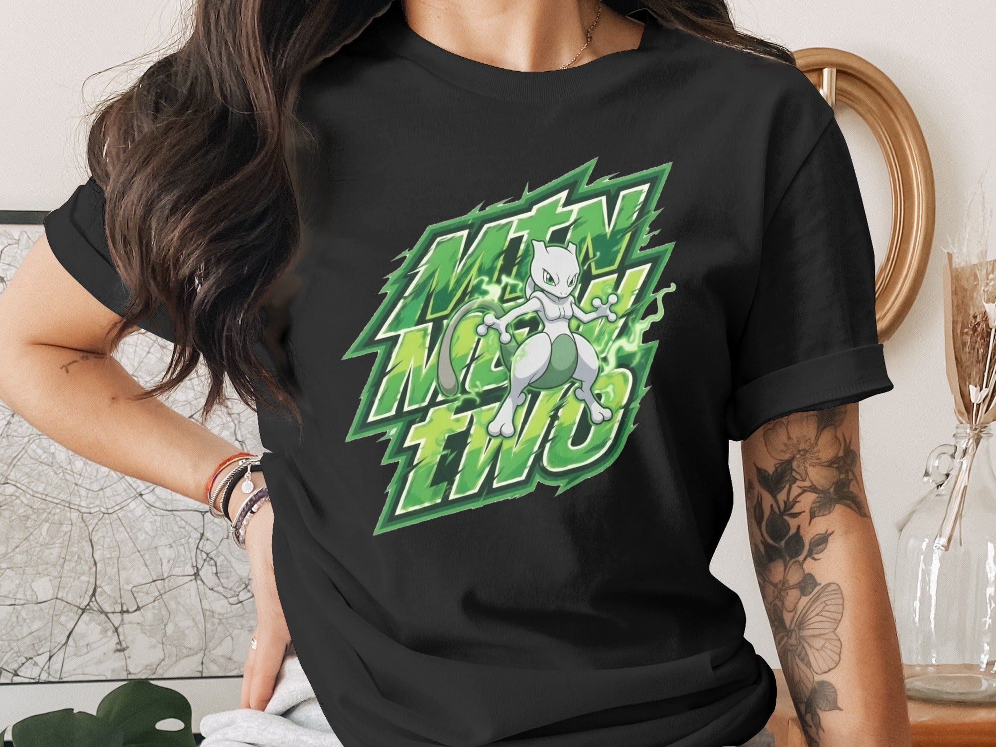 Black t-shirt with green Mewtwo graphic and text.