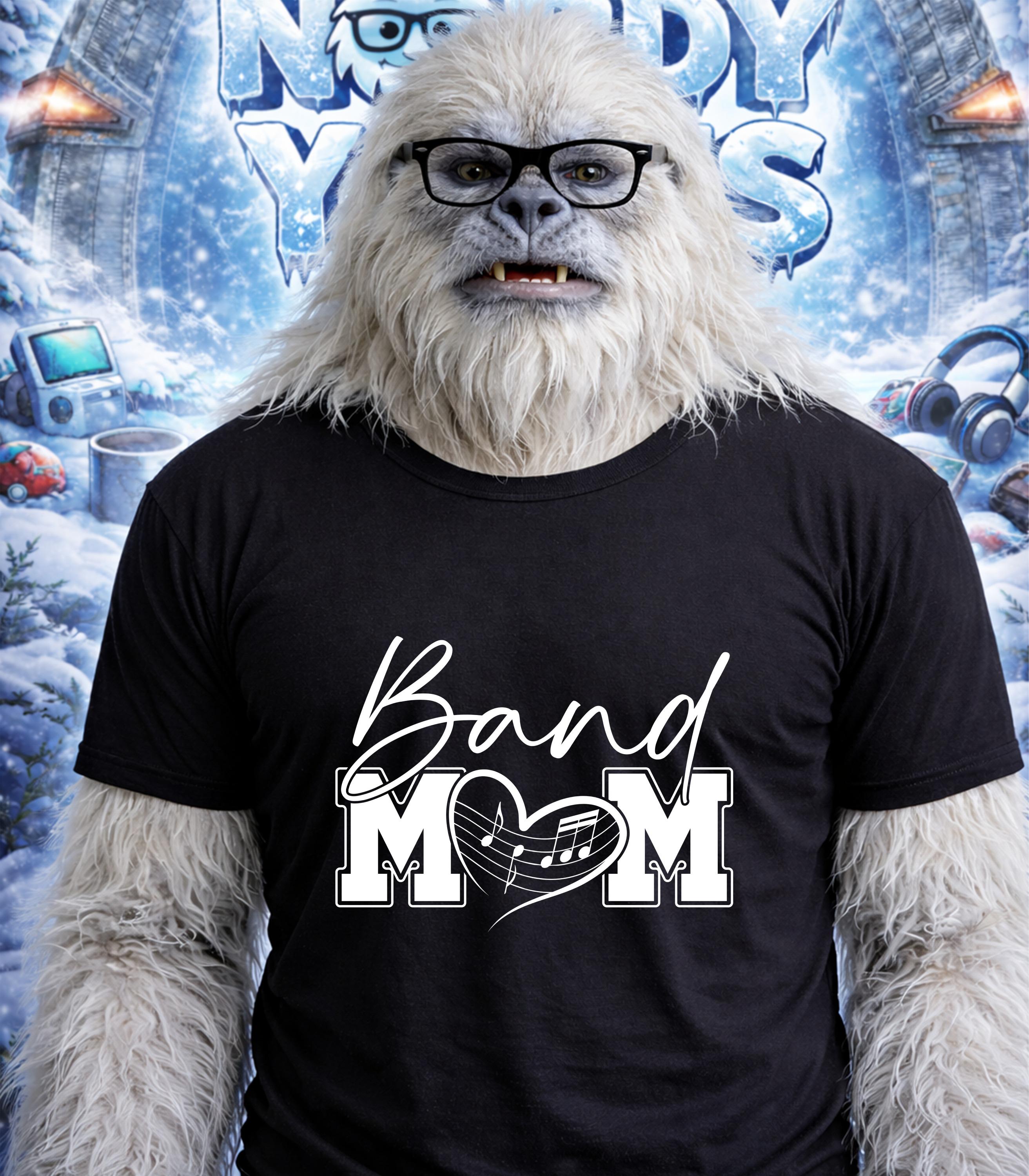 Yeti wearing a black t-shirt with "Band Mom" and a musical heart.