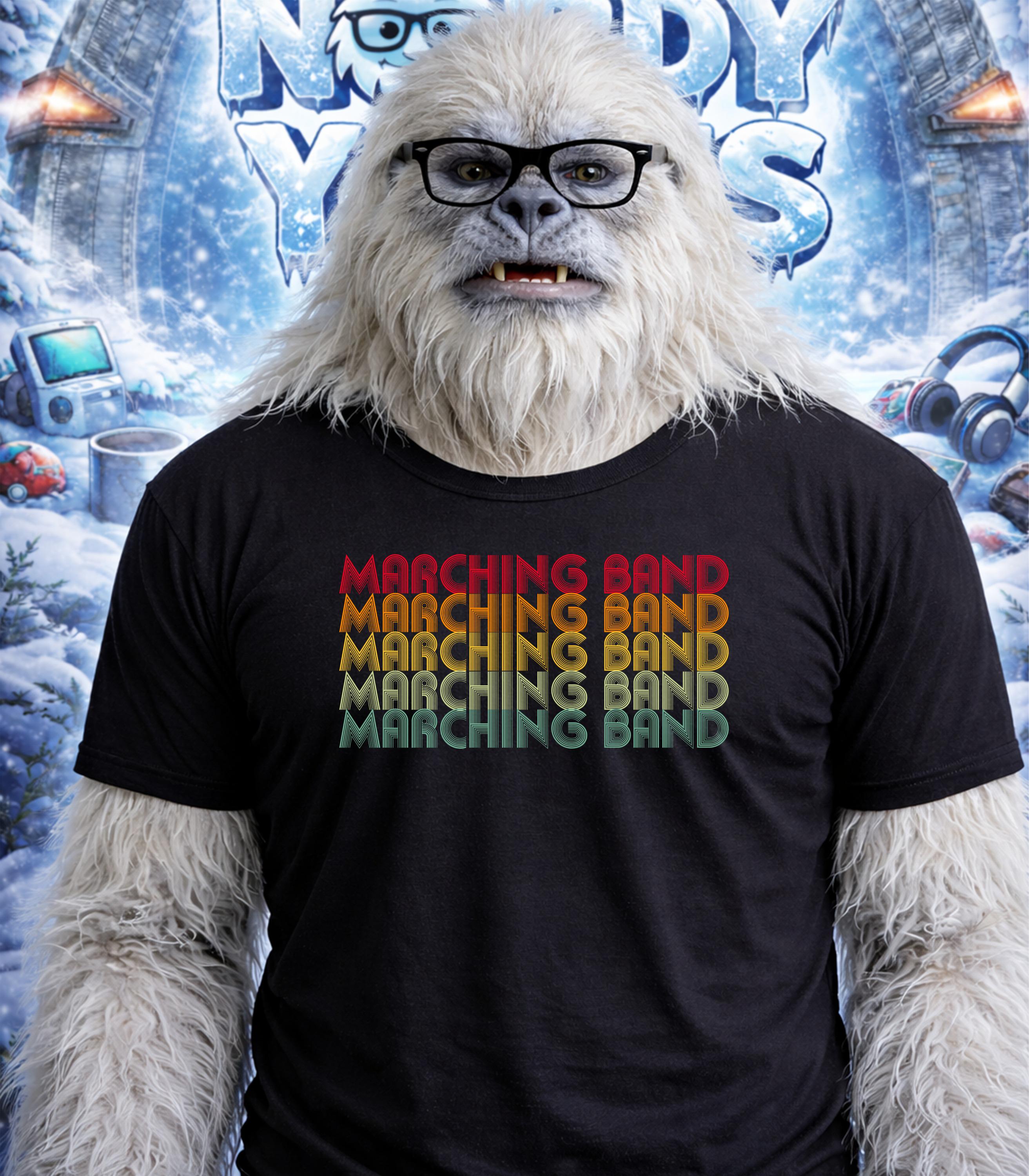 Yeti wearing a black t-shirt with "Marching Band" in retro rainbow text.