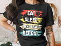 Black t-shirt with "Eat Sleep Pickleball Repeat" in colorful text.