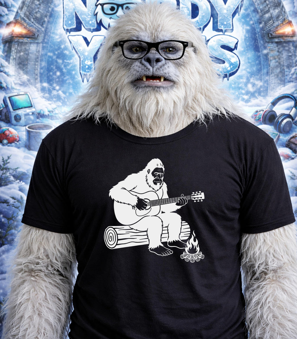 Yeti wearing glasses and t-shirt with yeti playing guitar on log graphic.