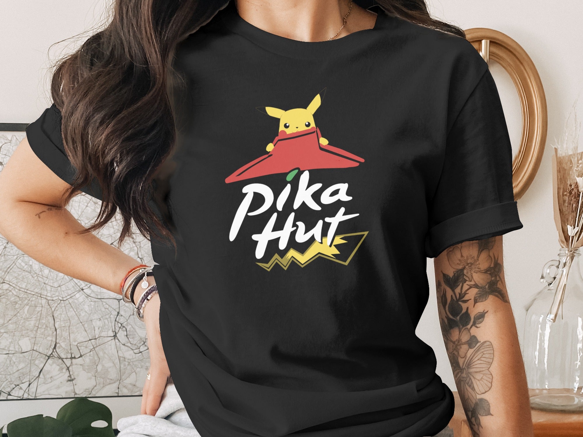 Black t-shirt with Pikachu and "Pika Hut" logo.
