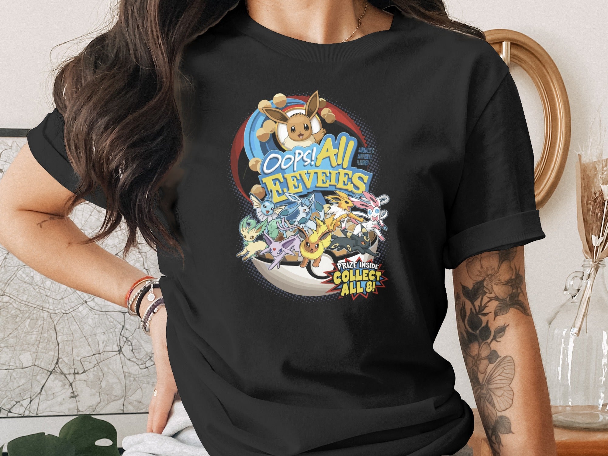 T-shirt with colorful Eevee and its evolutions, "Oops! All Eevees! Prize Inside Collect All!"