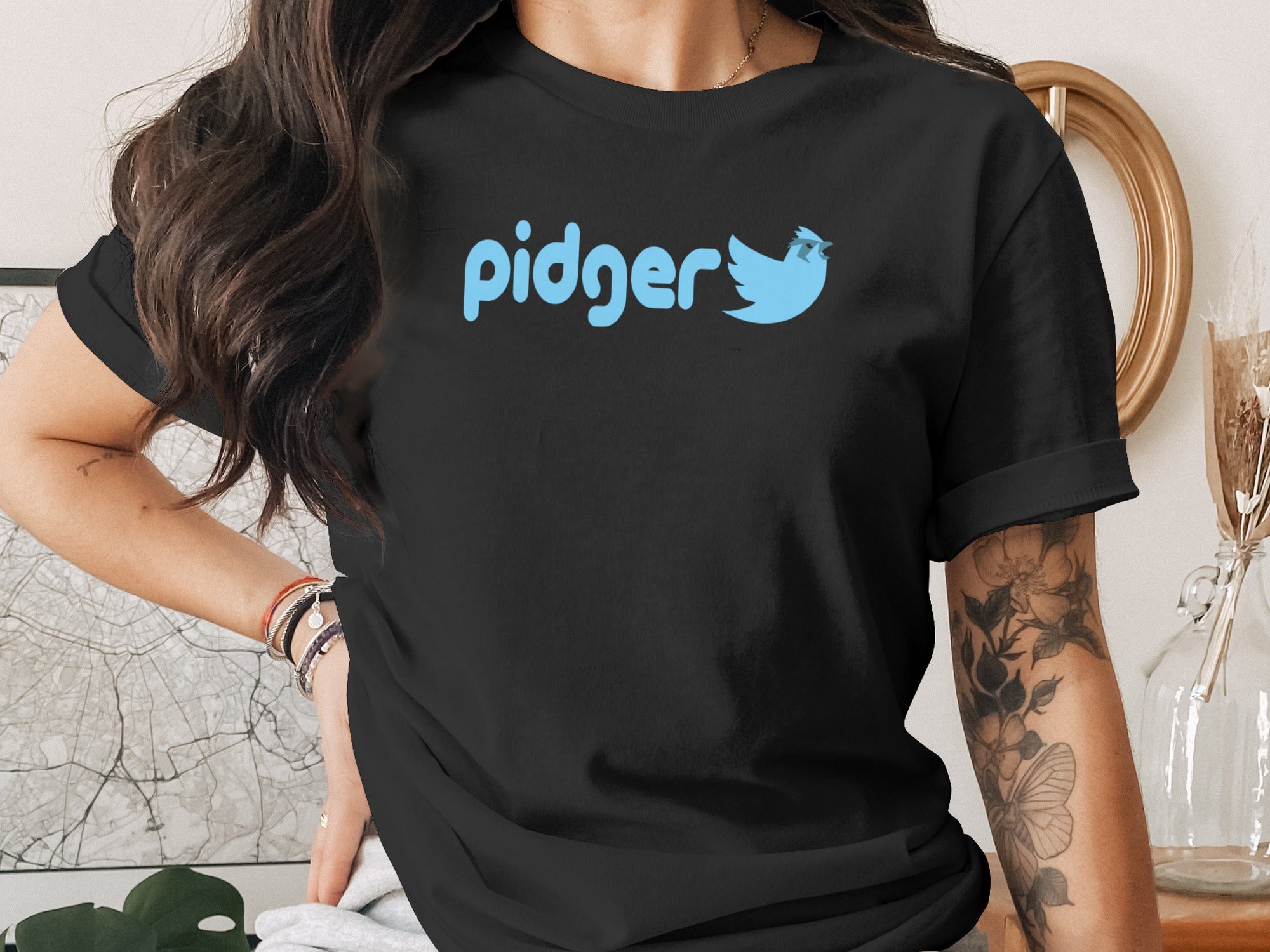 Black t-shirt with blue "pidger" text and bird logo.