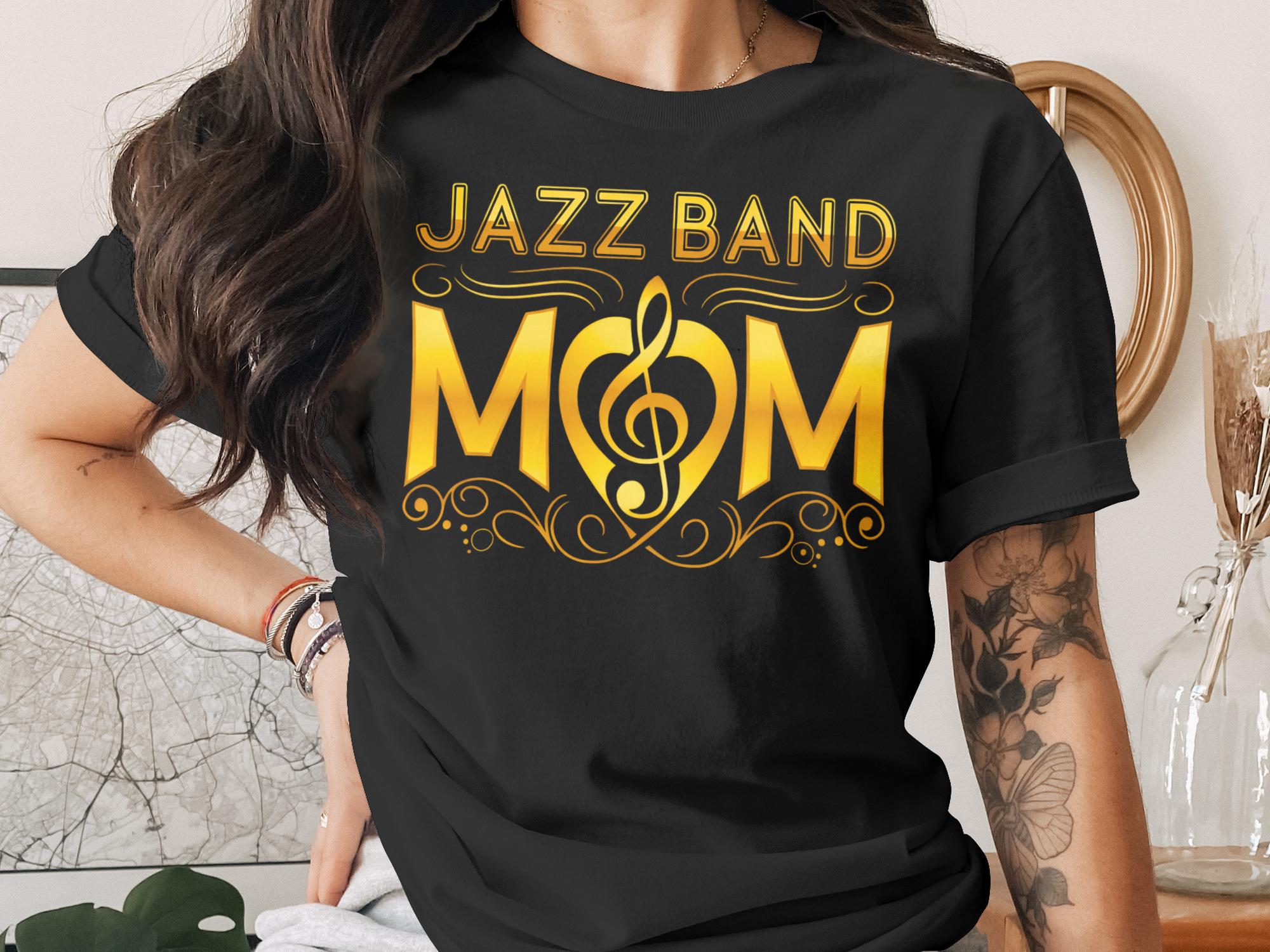 Black t-shirt with "JAZZ BAND MOM" in gold lettering and a musical note heart.