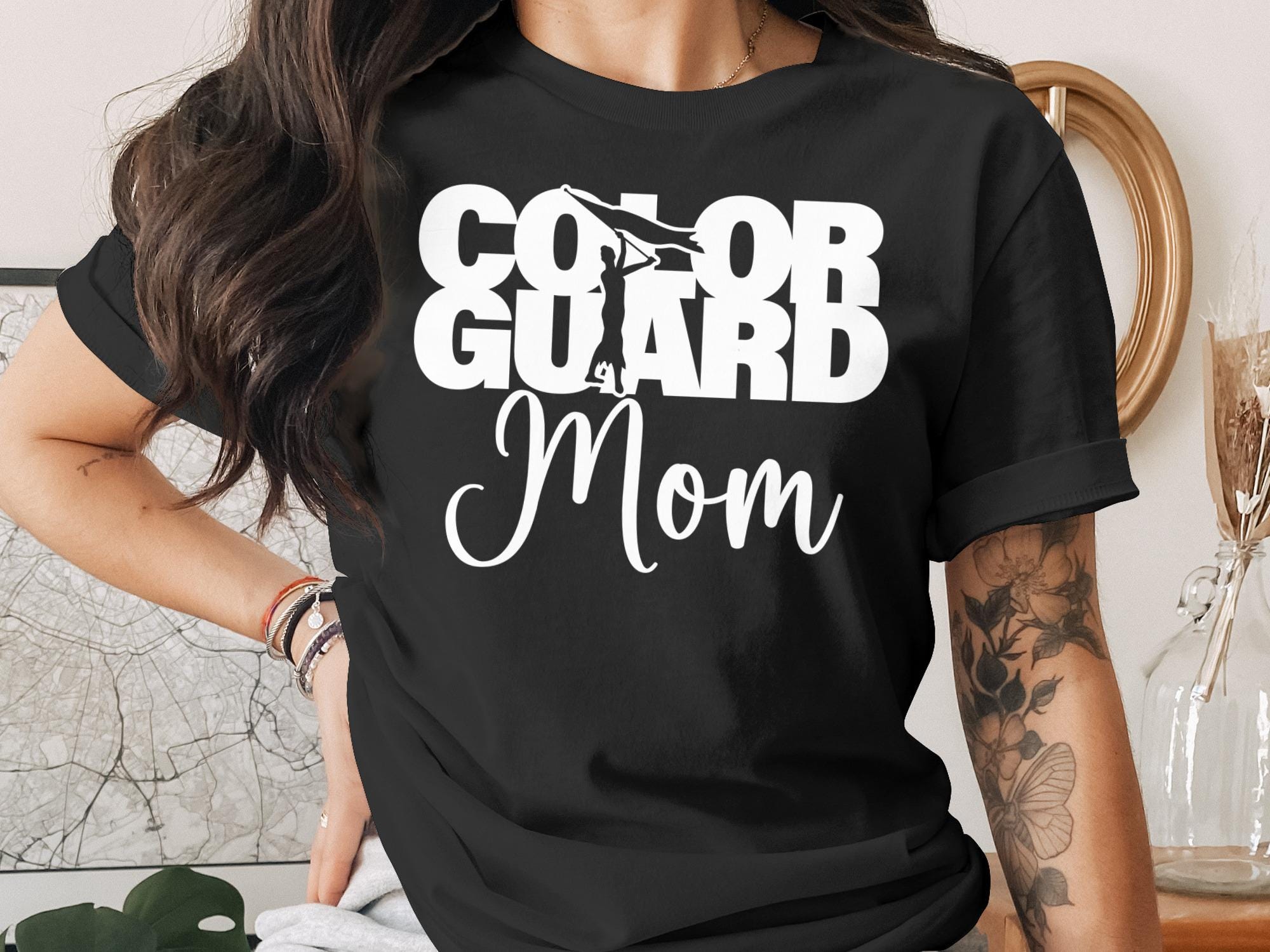 Black t-shirt with "COLOR GUARD Mom" text in white graphic.
