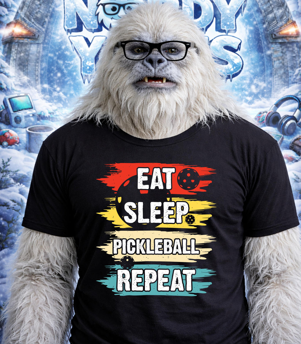 Yeti wearing a "Eat Sleep Pickleball Repeat" t-shirt.