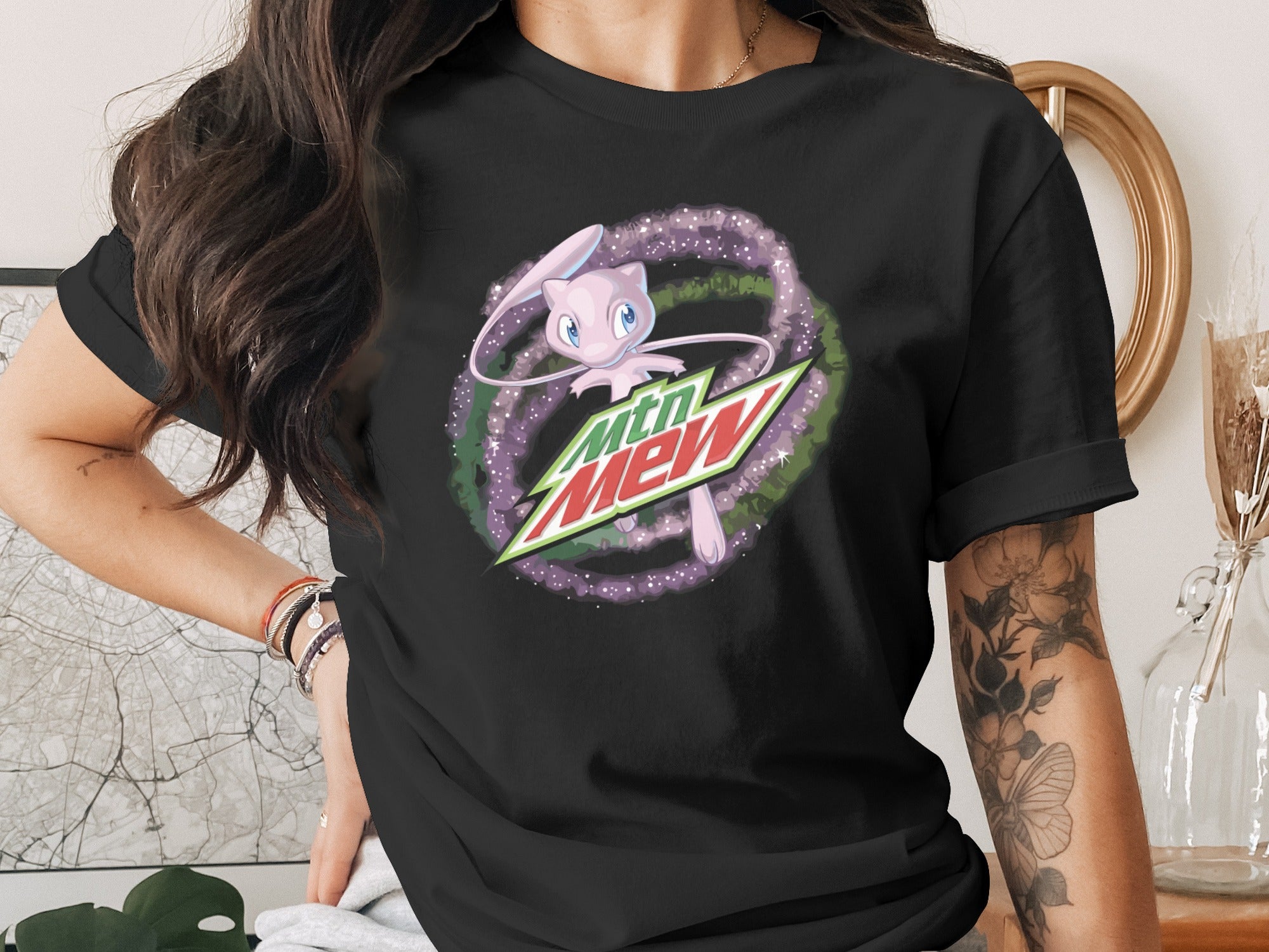 Black t-shirt with Mtn Dew logo and Mew character graphic.