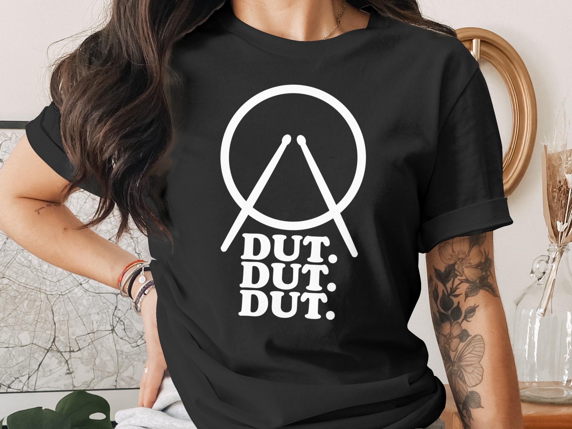 Black t-shirt with white drummer graphic and "DUT. DUT. DUT." text.