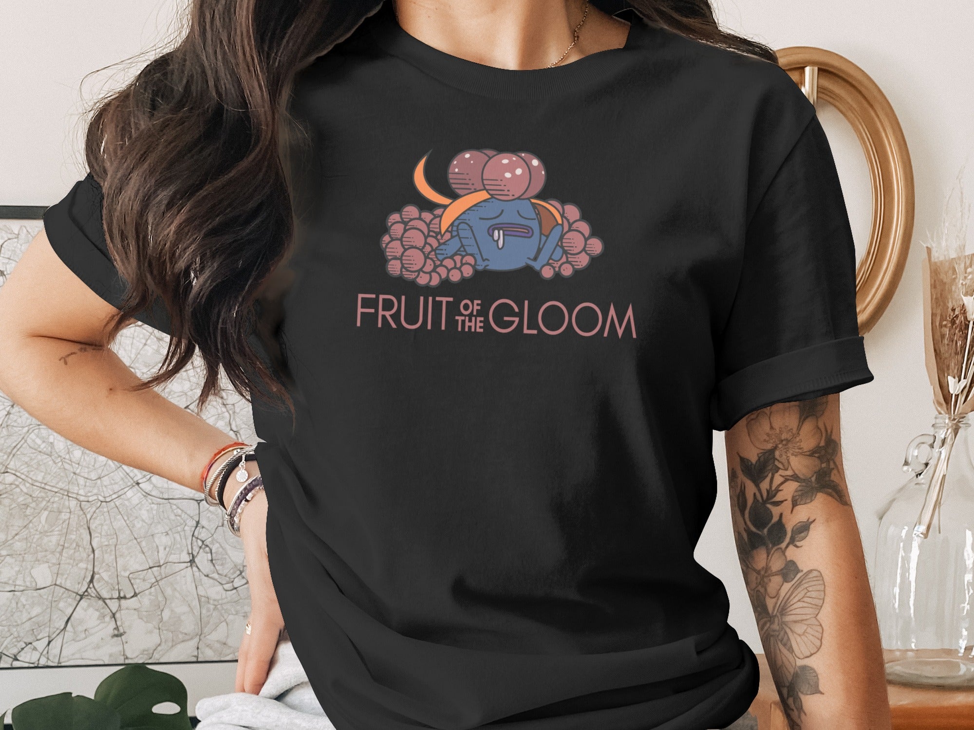 Black t-shirt with cartoon monster and "FRUIT OF THE GLOOM" text.