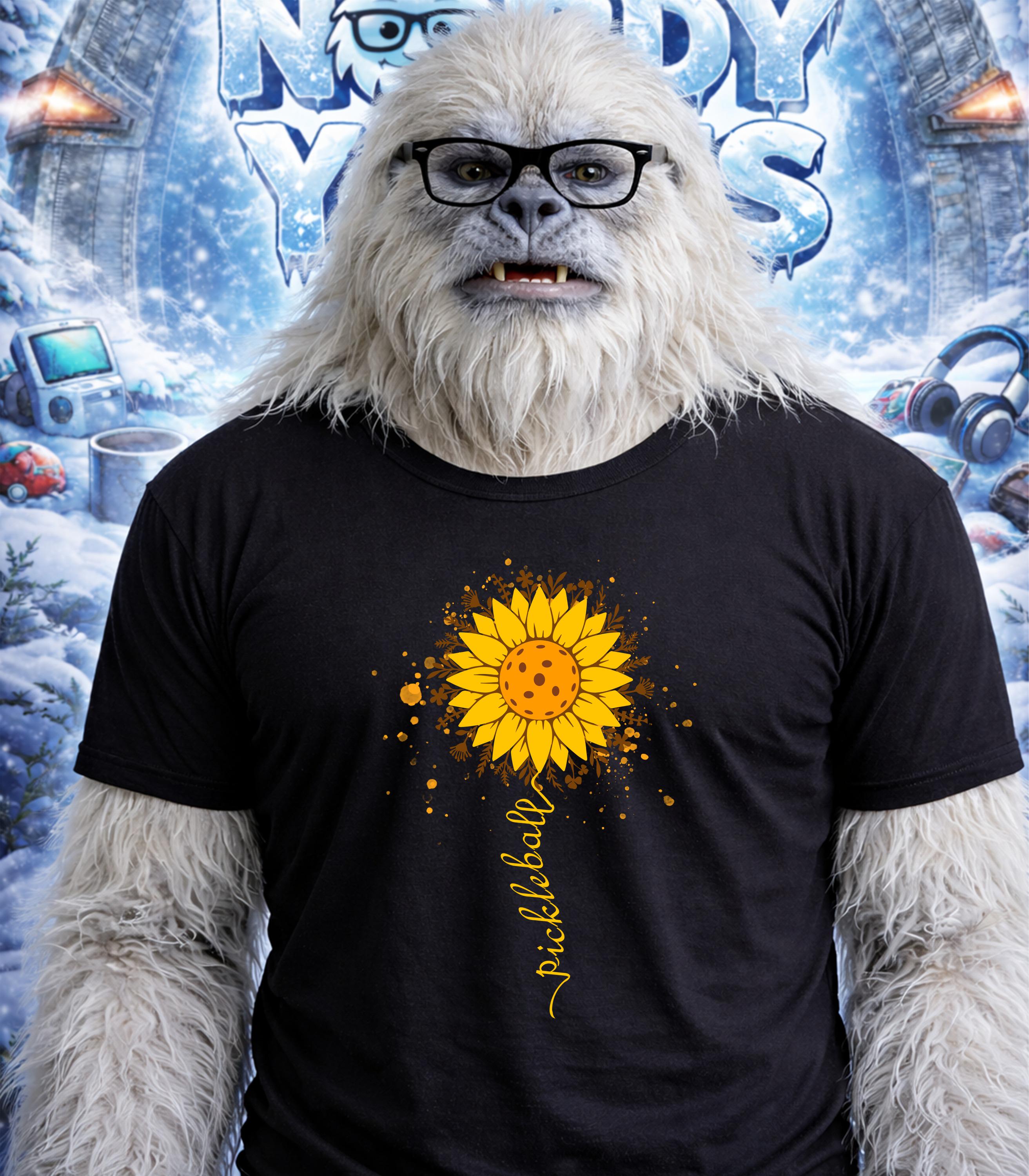 Yeti wearing glasses and a t-shirt with a sunflower and "pickleball" text.