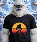 Yeti wearing glasses and a t-shirt with a skateboarding silhouette.