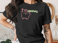 Black t-shirt with a pink cartoon character and "pinkfairy" text.