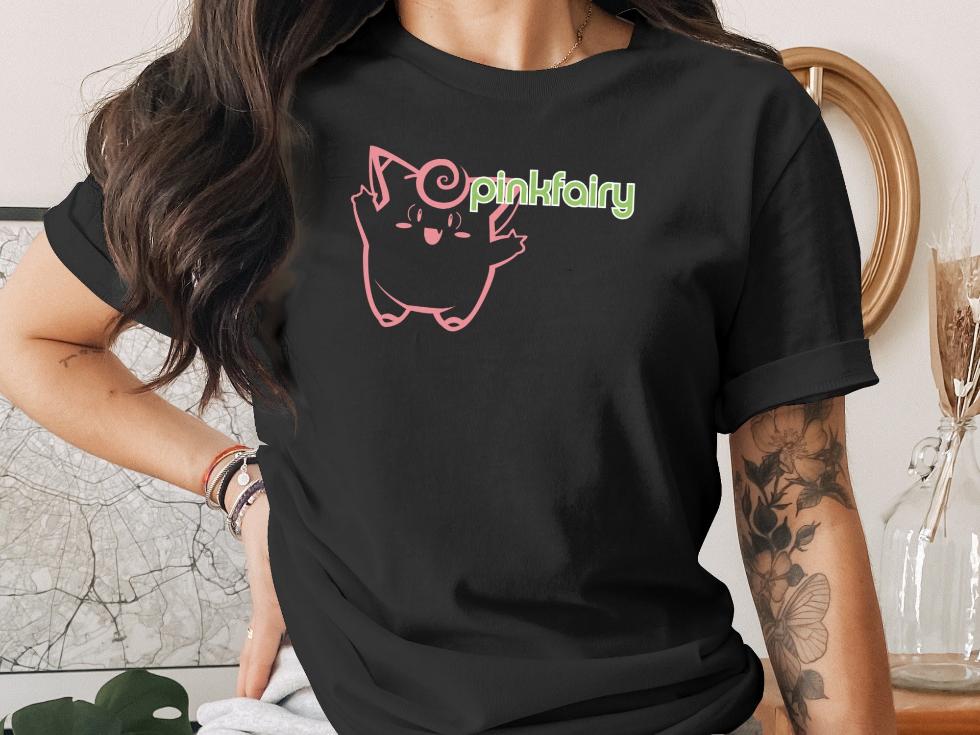 Black t-shirt with a pink cartoon character and "pinkfairy" text.