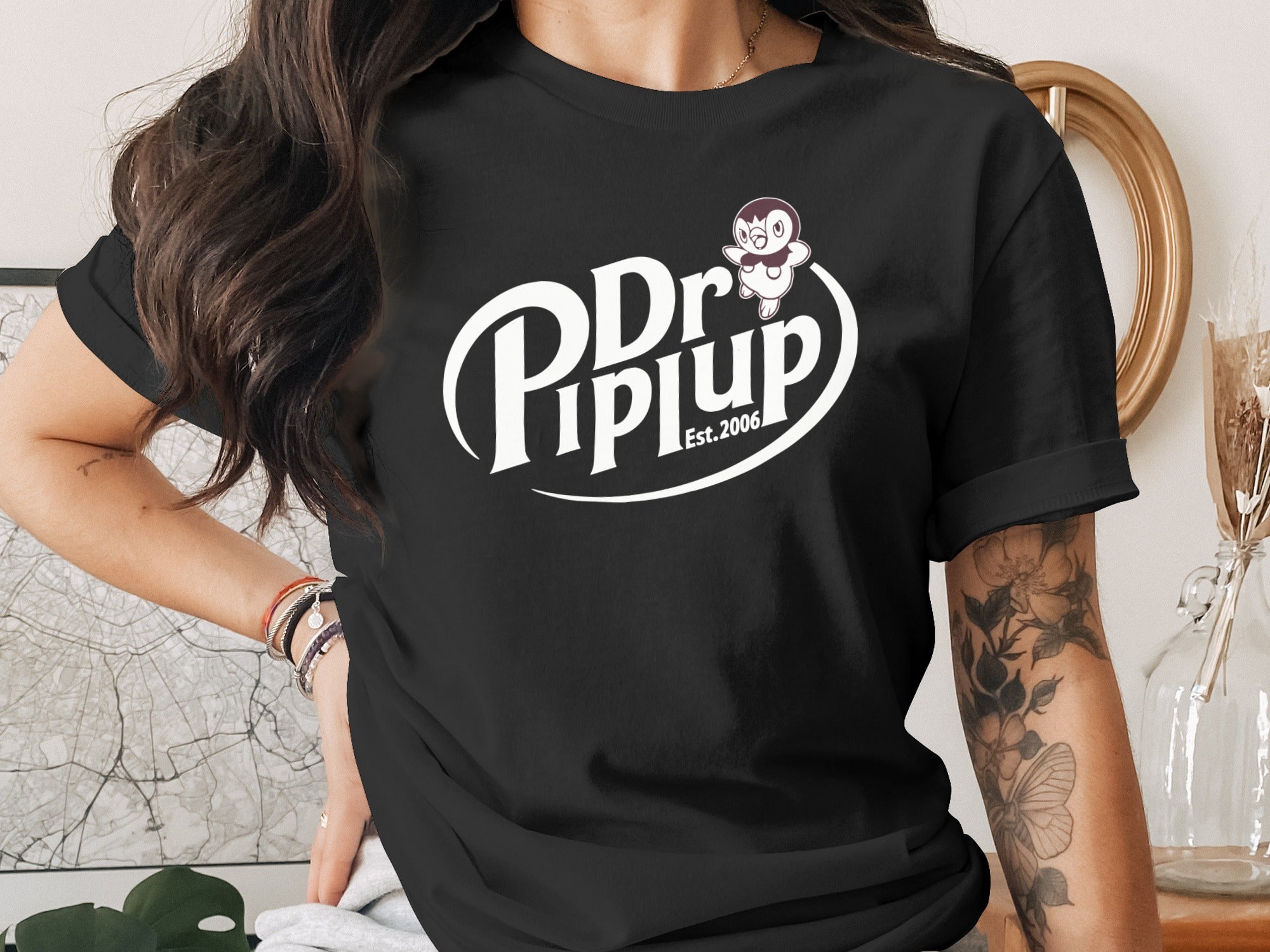 Black t-shirt with Dr. Piuplup logo and "Est. 2006" text.