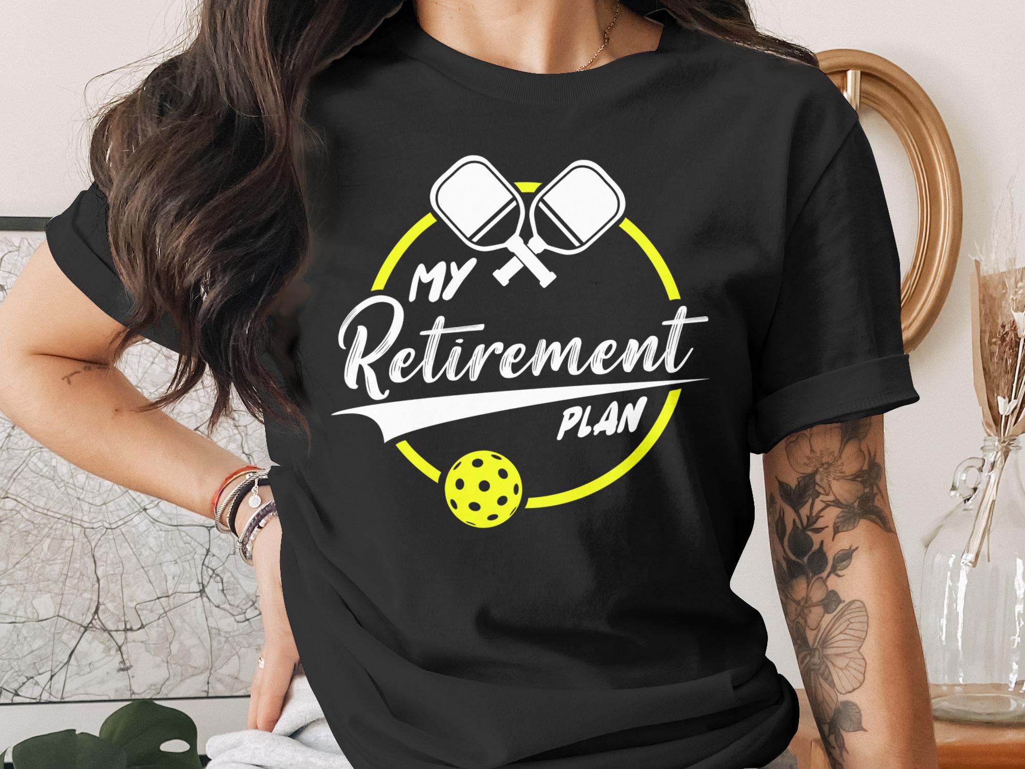 Black t-shirt with "My Retirement Plan" and pickleball graphic.