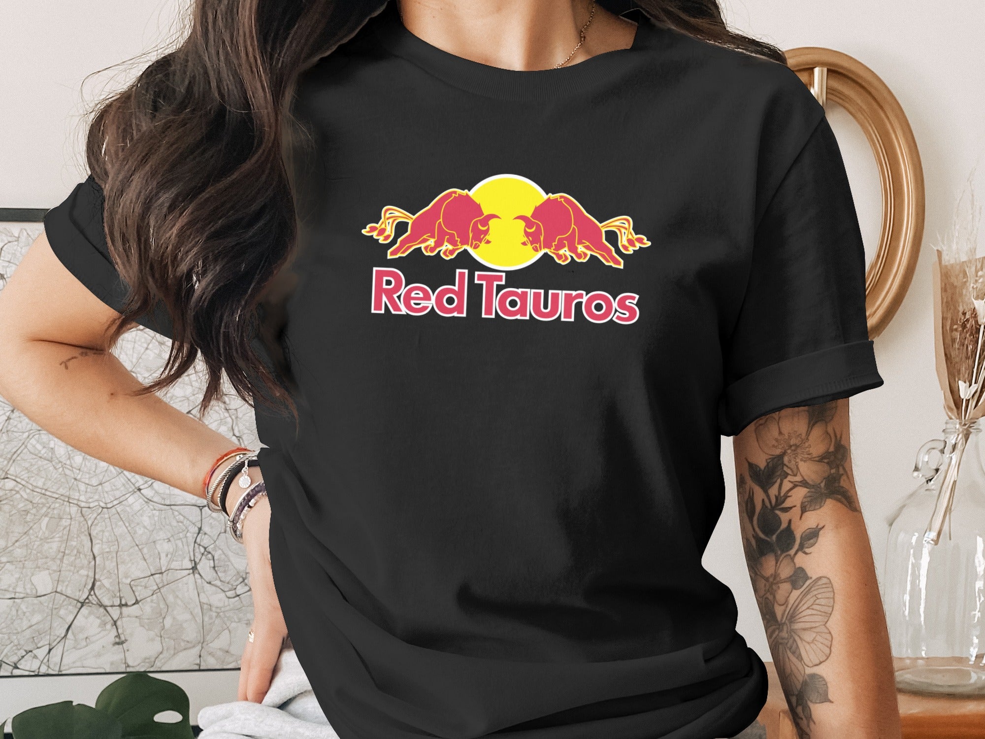 Black t-shirt with Red Tauros logo featuring two charging bulls and a sun.