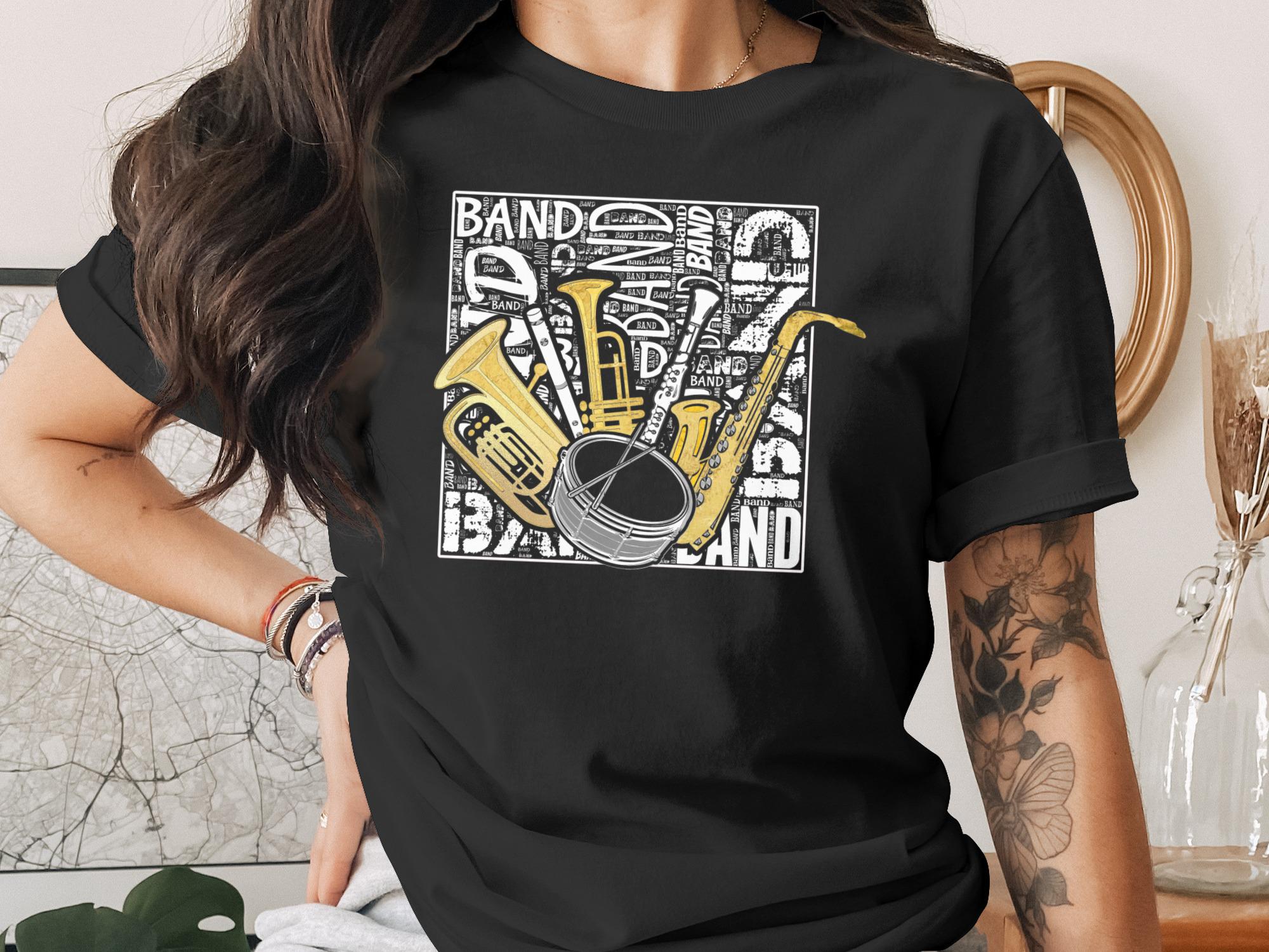 Black t-shirt with collage of brass instruments and "BAND" text.