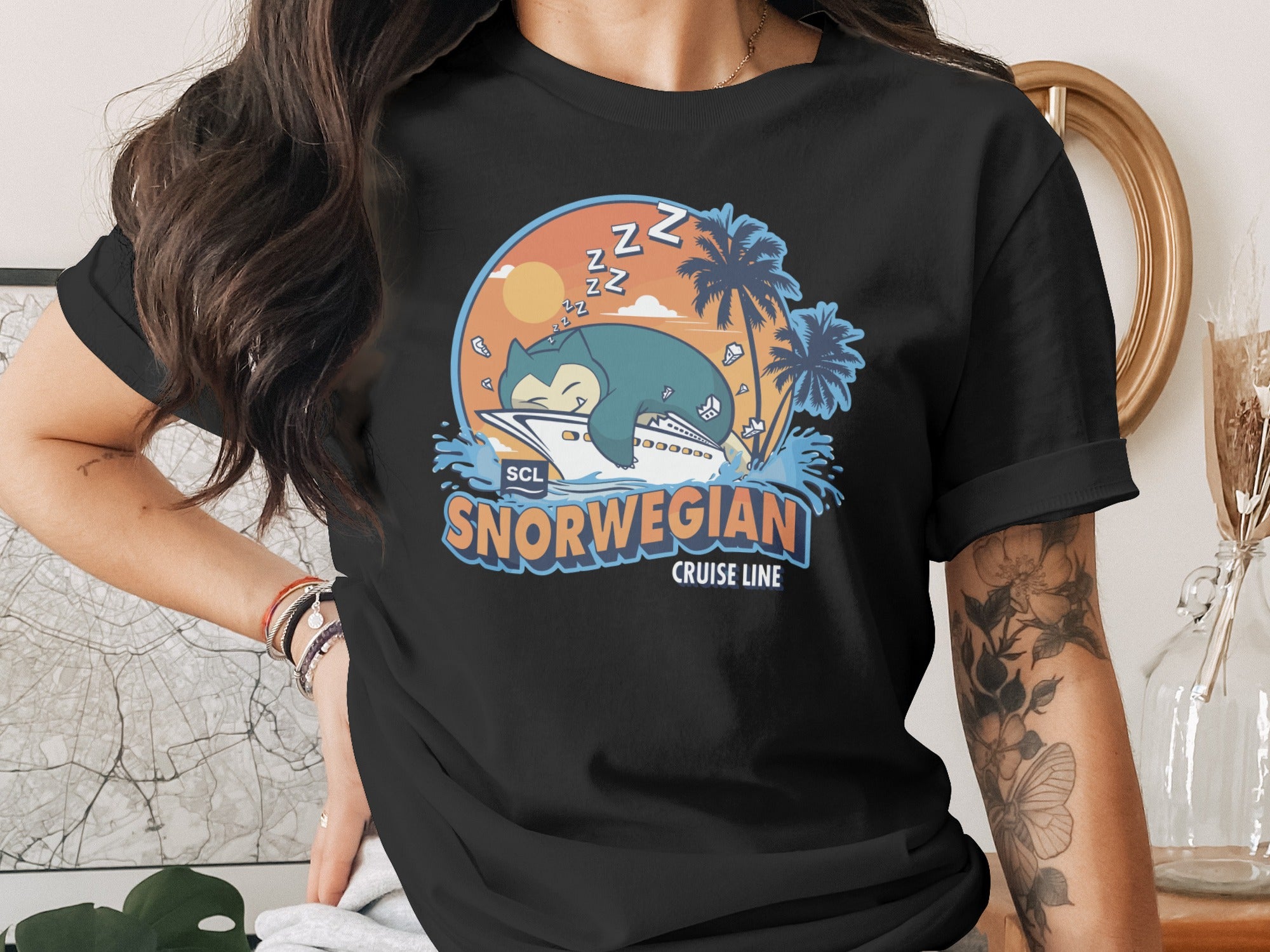 Norwegian Cruise Line t-shirt featuring a sleeping Snorlax character by palm trees.