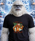 Yeti wearing glasses and a "Hide and Seek-mas" t-shirt.